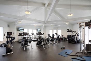 Fitness and strength training center with locker rooms